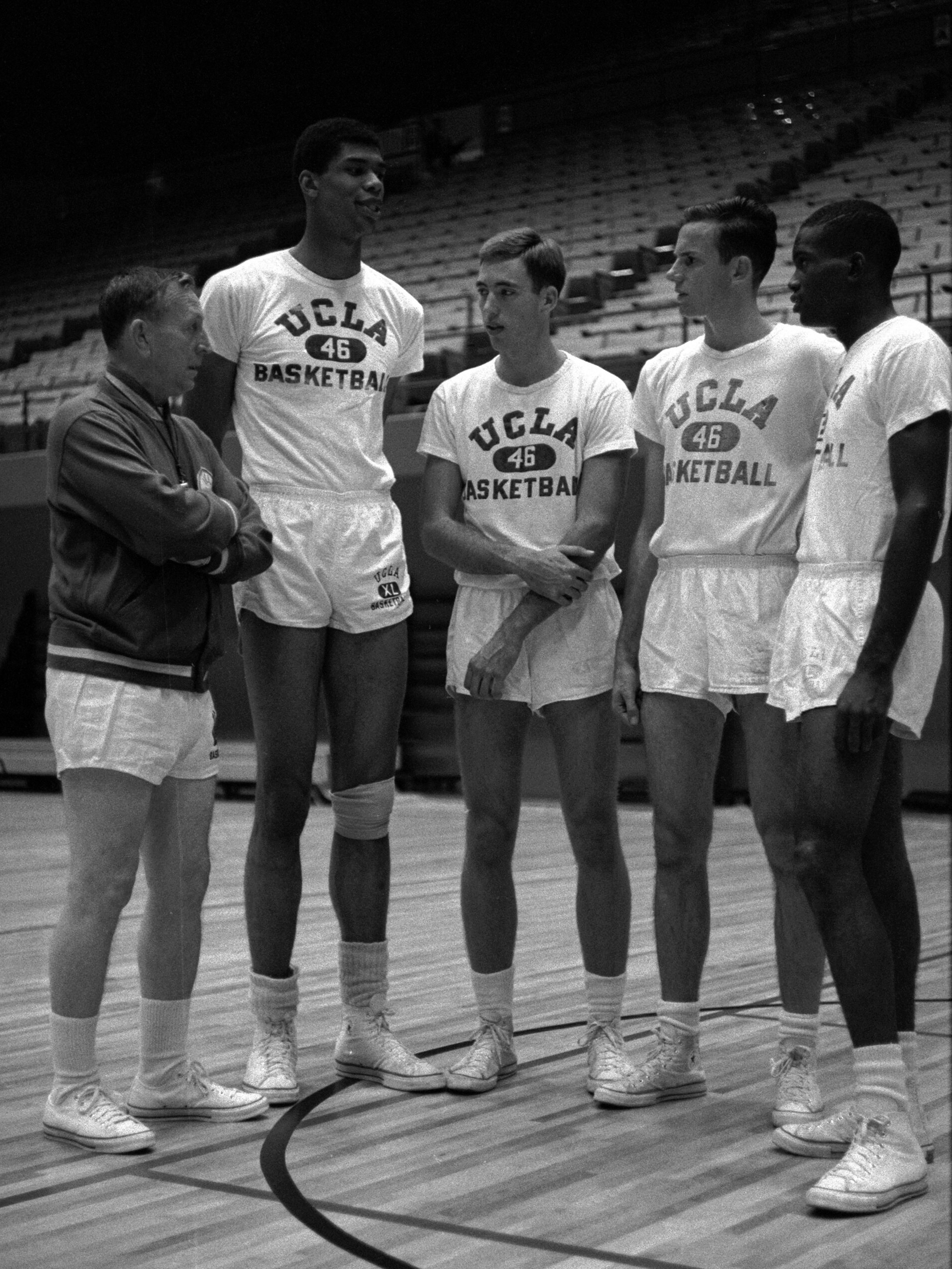 1960s photo of UCLA basketball coach John Wooden with four freshman All-American recruits: Lew Alcindor (later Kareem Abdul-Jabbar), Lynn Shackleford, Kenny Heitz, and Lucius Allen