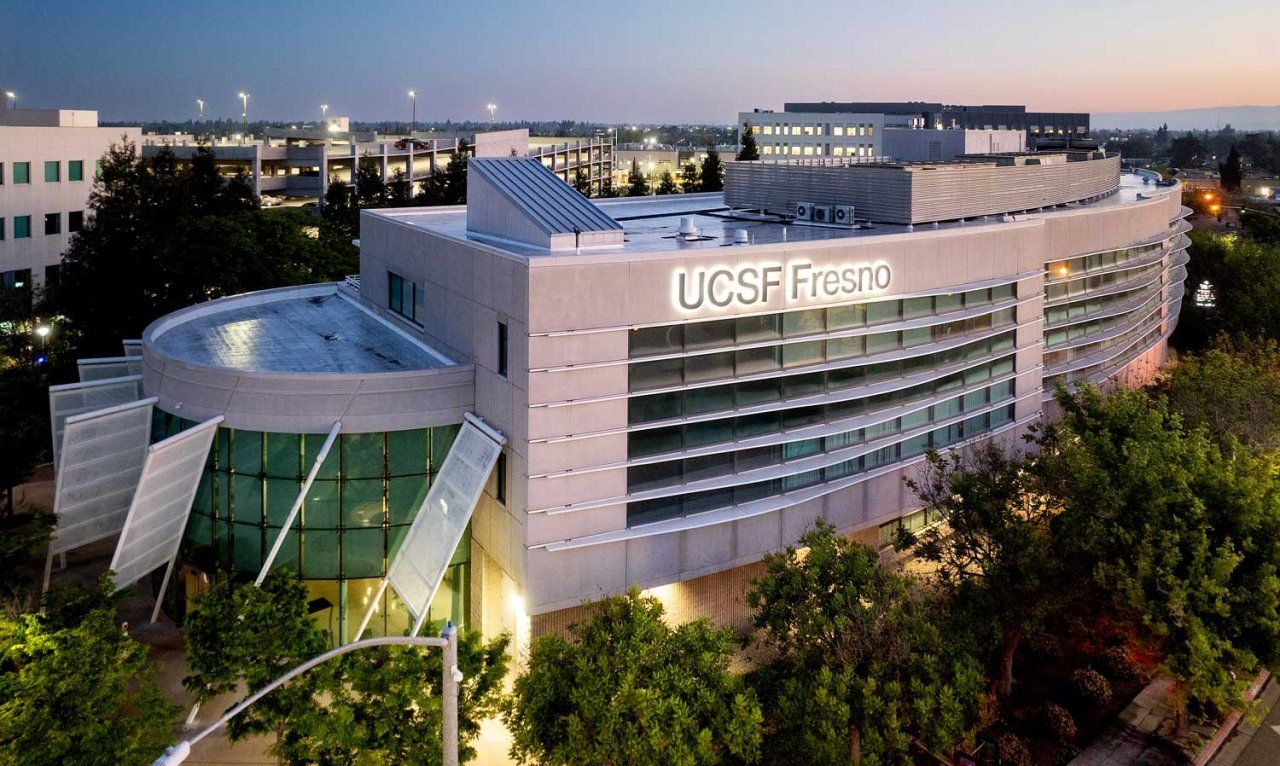 UCSF Fresno building viewed from above and at an angle at evening