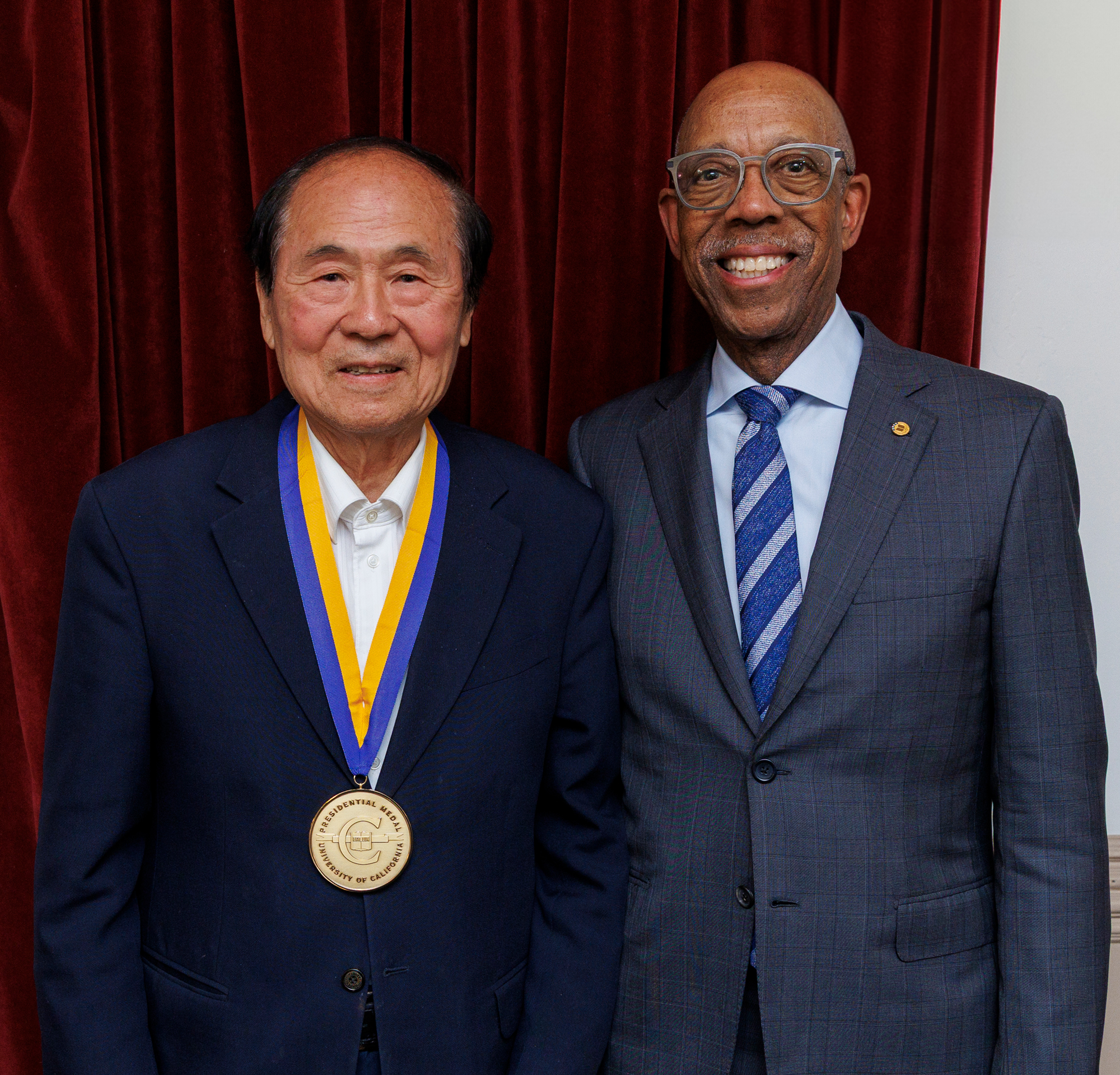 Chancellor Yang wearing his UC Presidential medal next to President Drake