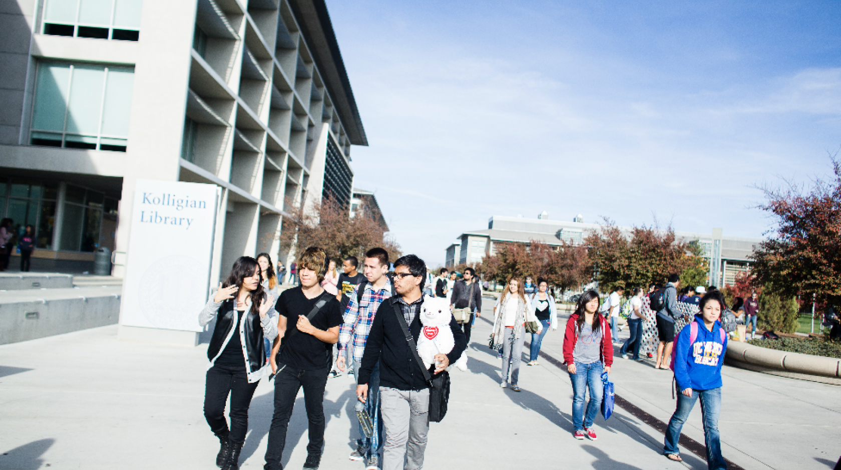 Students walk past the UC Merced library