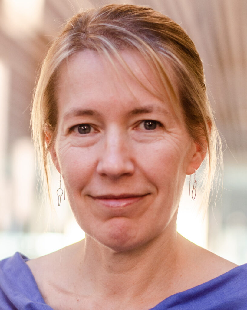 Allison Harvey smiles at the camera in a shoulders-up portait.