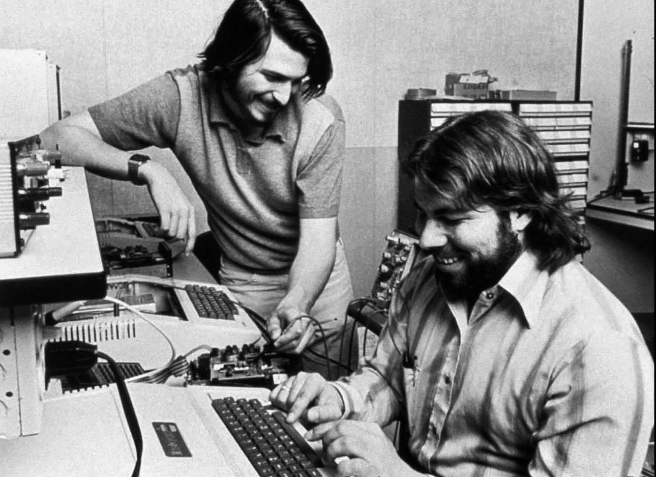 Steves Wozniak and Jobs work on an early version of an Apple computer. 