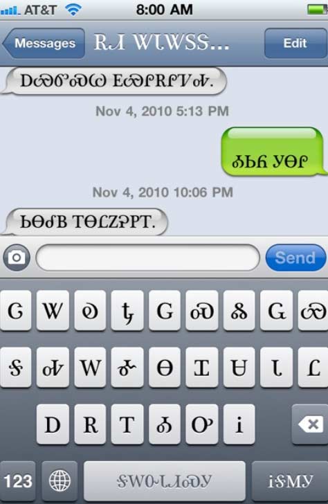 An iPhone text message screen with messages in the Cherokee language (Tsalagi)