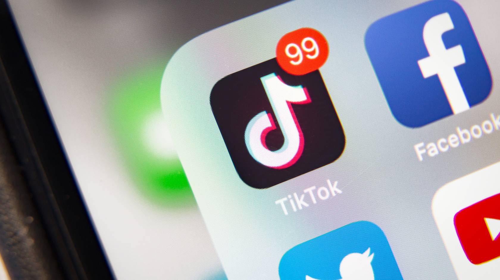 TikTok and other social media icons on a phone