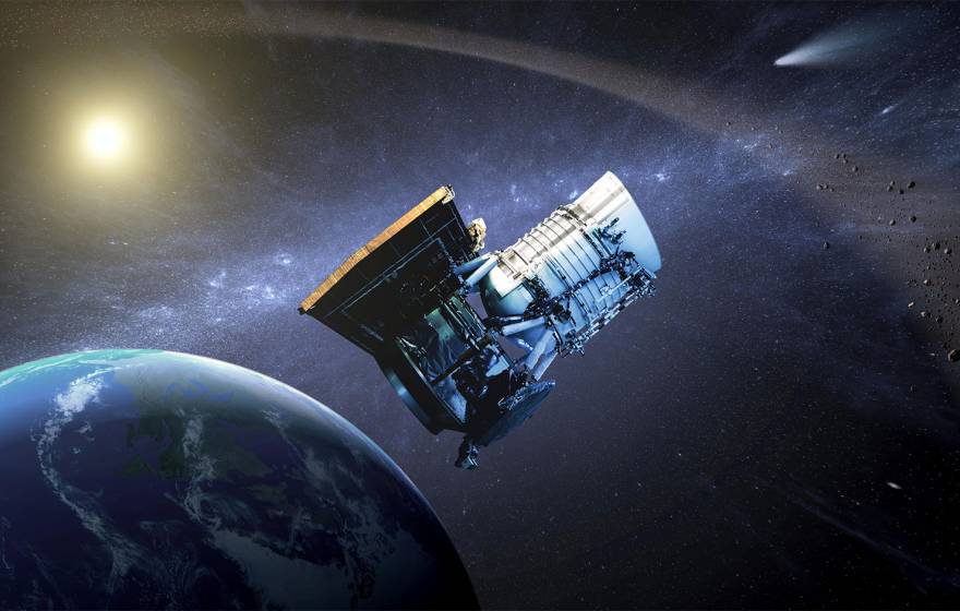 This artist's concept shows the Wide-field Infrared Survey Explorer, or WISE spacecraft, in its orbit around Earth. 