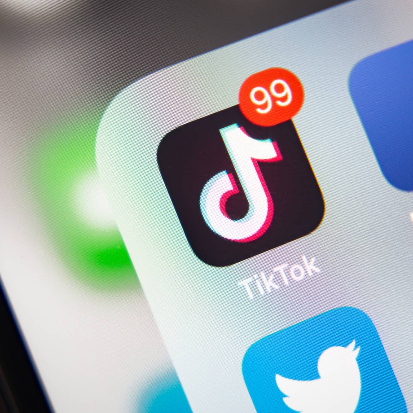 TikTok and other social media icons on a phone