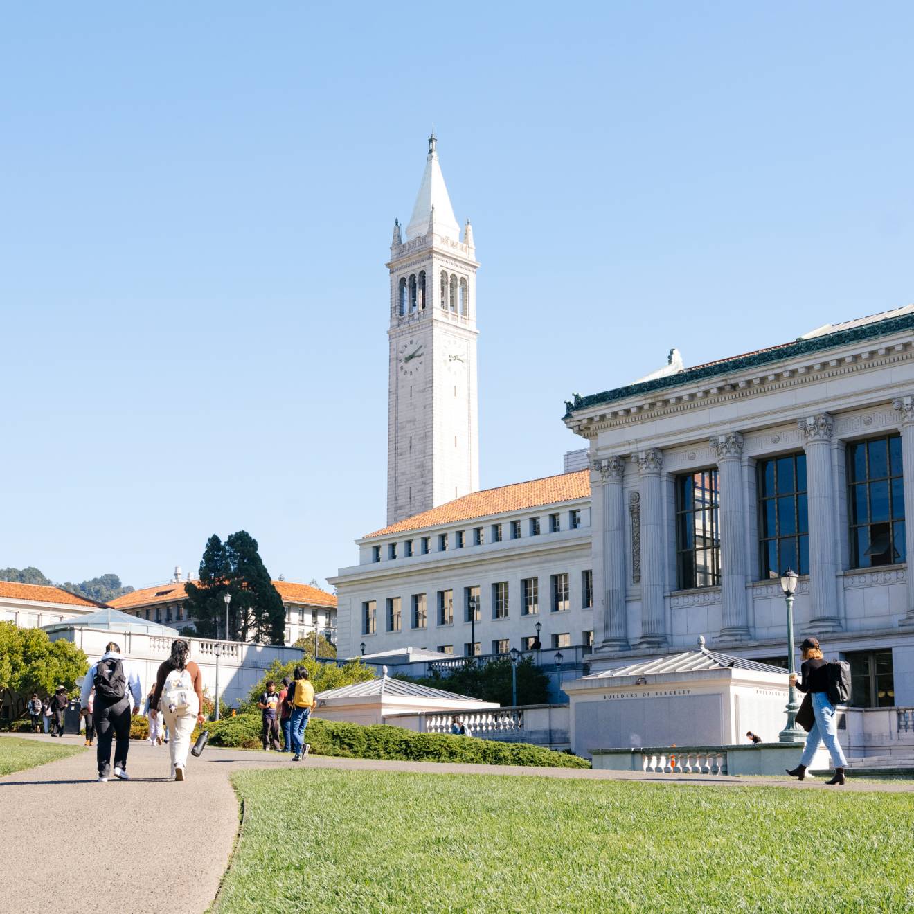 A view of the UC Berkeley campus, including Sather Tower and the library, on a day with a blue sky