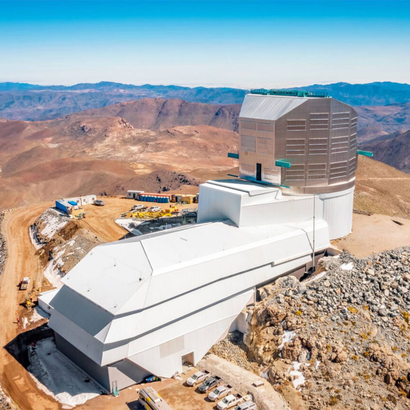 A large astronomical observatory on a bare, rocky mountain peak