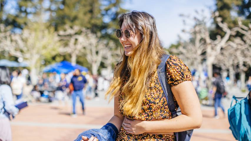 student smiling on Berkeley campus